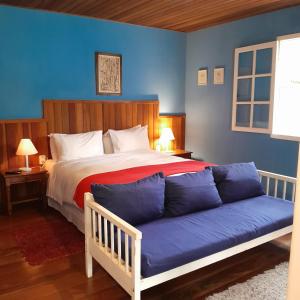 Un pat sau paturi într-o cameră la Pousada Olho D'Água