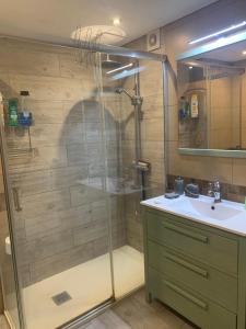 a bathroom with a shower and a sink at Apartamento maspalomas 3 hab stay in gran canaria in Maspalomas