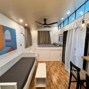 a small living room with a couch and a table at The Orchard Private Villa with Pool and Wifi in Cuenca Batangas in Cuenca