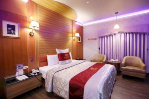 Voodi või voodid majutusasutuse Wen Sha Bao Motel-Xinying toas
