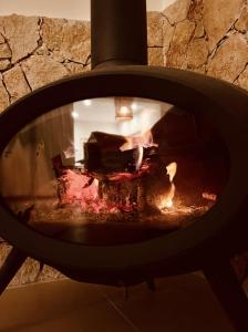 a stone oven with a piece of cake in it at Haroupia Hillside Villa in Kalymnos