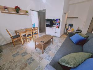 a living room with a couch and a table at STAY Kallipoleos Apartment in Nicosia