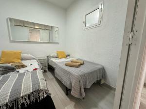 Posteľ alebo postele v izbe v ubytovaní CG131 - Centro 50 metros, Playa 650 metros, Wifi, Fire Stick Amazon + 18 fotografií