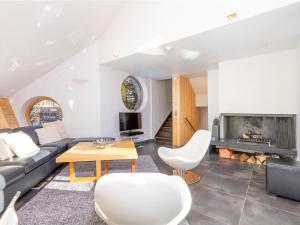 a living room with a couch and a fireplace at Chalet Avoriaz, 7 pièces, 12 personnes - FR-1-314-230 in Morzine