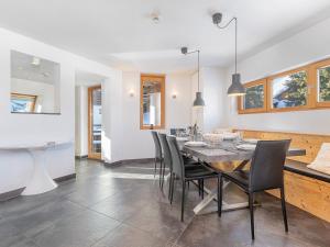 a dining room and kitchen with a table and chairs at Chalet Avoriaz, 7 pièces, 12 personnes - FR-1-314-230 in Morzine