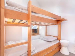 two bunk beds in a room with a toilet at Chalet Avoriaz, 7 pièces, 12 personnes - FR-1-314-230 in Morzine