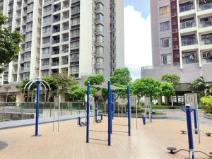 a group of blue poles on a sidewalk in a city at Sofia Superior Suite 2R2B-51902 at R&F Princess Cove in Johor Bahru