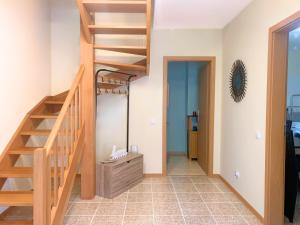 a room with a staircase and a mirror at Santana House - Holiday Rental by Your Key in Santana