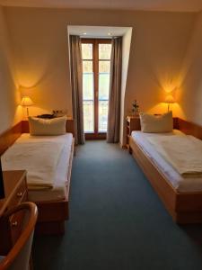 Postel nebo postele na pokoji v ubytování Gasthof Hummel Hotel