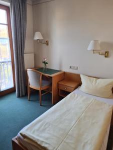 Postel nebo postele na pokoji v ubytování Gasthof Hummel Hotel