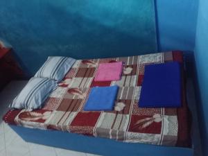 Una cama o camas en una habitación de Casa Minha Backpackers Hostel