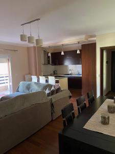 a living room with a couch and a table at Mollys2apartment in Pogradec