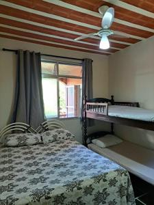 Postelja oz. postelje v sobi nastanitve Casa Costa Verde-Muriqui