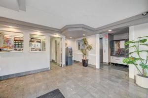 a lobby of a pharmacy with potted plants at Bridger Inn Hotel Downtown in Las Vegas