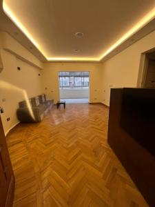 a living room with a couch and a flat screen tv at Cairo de casa hostel in Cairo +12 photos
