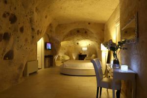TV a/nebo společenská místnost v ubytování Caveoso Hotel