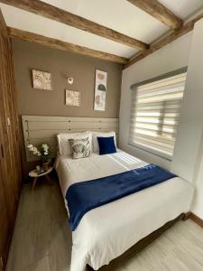 a bedroom with a large bed in a room at Apartamento PUERTA DE LA VILLA in Villa de Leyva +38 photos