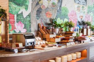 a bakery with bread and pastries on a counter at OCEANFRONT PANORAMA RESIDENCE in Nha Trang