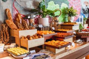 a bakery with different types of bread and pastries at OCEANFRONT PANORAMA RESIDENCE in Nha Trang