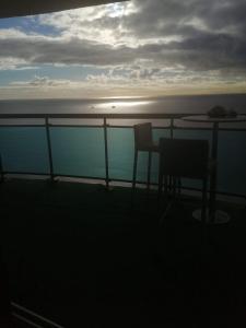 a balcony with two chairs and a table on a ship at Bello amanecer in Santo Domingo
