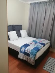 Postel nebo postele na pokoji v ubytování Quietcozy