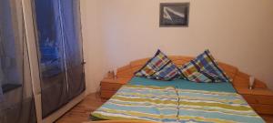 a bedroom with a bed with two pillows on it at Wunderschönes Sauerland in Plettenberg