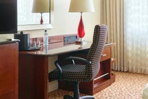 a chair sitting at a desk in a hotel room at Atlanta Marriott Buckhead Hotel & Conference Center in Atlanta