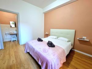 Postel nebo postele na pokoji v ubytování Morfeo B&B