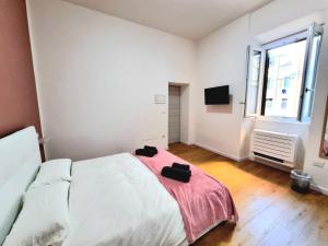 Postel nebo postele na pokoji v ubytování Morfeo B&B