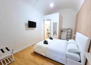 Postel nebo postele na pokoji v ubytování Morfeo B&B