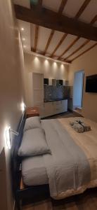 a bedroom with a large bed with pillows on it at Casa Stella in Genzano di Roma +24 photos