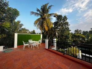 a patio with a table and chairs on a balcony at Sagya Residencies in Panadura