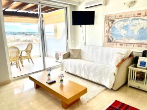 a living room with a white couch and a table at Apartment in Lagos in Lagos