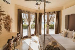 Postel nebo postele na pokoji v ubytování Casa Punta Coco & Beach Club