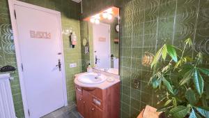 a bathroom with a sink and a mirror at Cala Canyelles Villa & Private Studio with Garden in Lloret de Mar +47 photos
