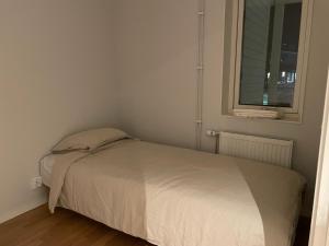 Postel nebo postele na pokoji v ubytování Svea Apartments in Rotebro