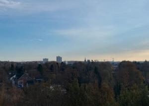 a view of a city with trees and buildings at Wohnung mit Blick über Itzehoe in Itzehoe