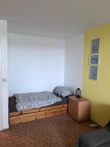 a bedroom with a bed and a box at Wohnung mit Blick über Itzehoe in Itzehoe