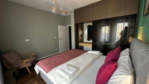 Кровать или кровати в номере Blini Exclusive 2