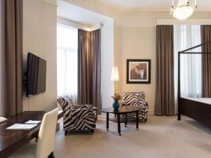 a hotel room with a zebra themed living room at Elite Hotel Knaust in Sundsvall