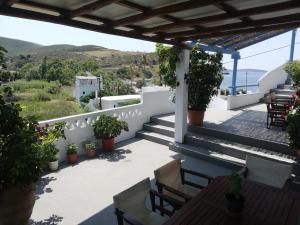 a view from the balcony of a house with plants at Blue House in Acherounes
