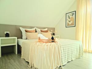 a bedroom with a large bed with a table at Homestay-Stylish, Zentral- Loft Apartment-Parking in Ingolstadt