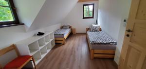 Postel nebo postele na pokoji v ubytování Dřevěnice v Brodské