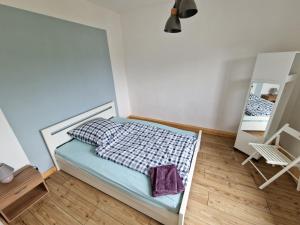 Ein Bett oder Betten in einem Zimmer der Unterkunft Wildemannstraße X