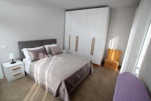 Postel nebo postele na pokoji v ubytování NOVA Sea View Apartments