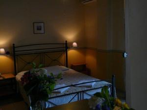 A bed or beds in a room at Alexandros Studios & Apartments