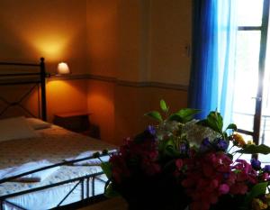 A bed or beds in a room at Alexandros Studios & Apartments