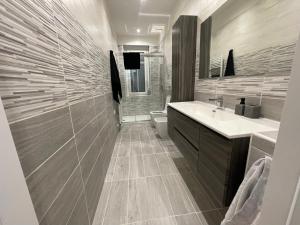 a bathroom with a sink and a toilet at Appartamento nel Borgo in Turin +34 photos