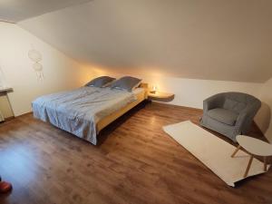 Postel nebo postele na pokoji v ubytování Zum weißen Stein