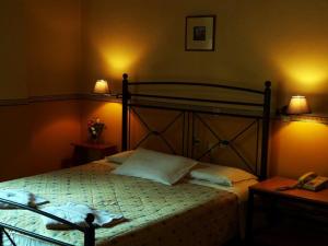 A bed or beds in a room at Alexandros Studios & Apartments